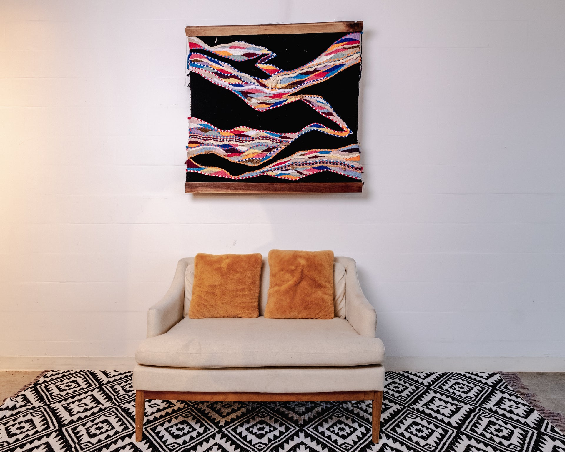 Handwoven Wall Tapestry in Black, Red, and Multi-Color Accents